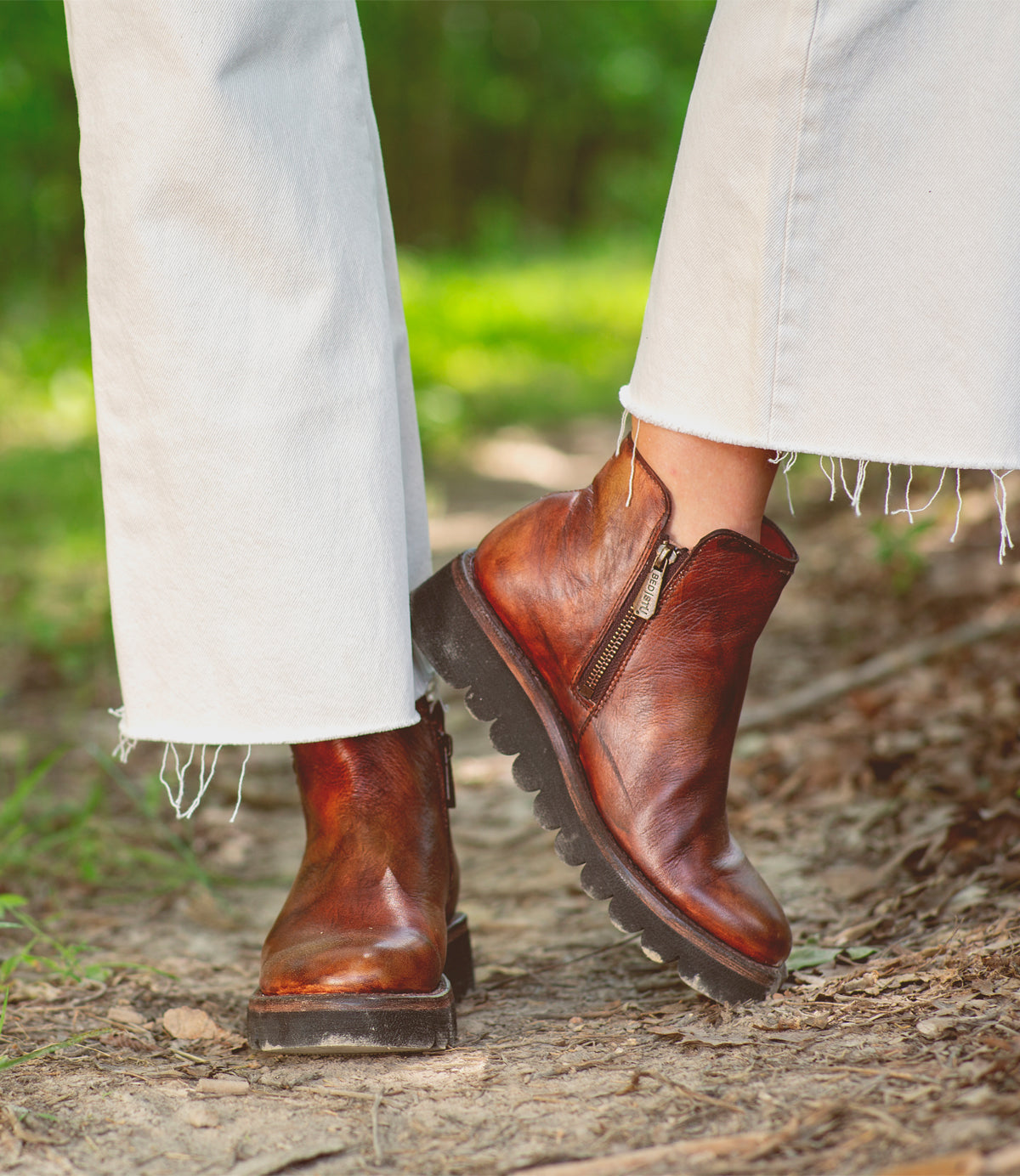 A woman wearing a pair of Bed Stu Lydyi boots.