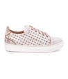 A women's white Lyne sneaker with studs and a white sole by Bed Stu.