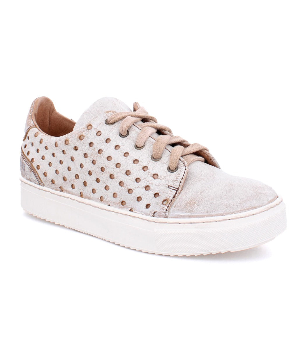 A women's beige Lyne sneaker with studded detailing by Bed Stu.