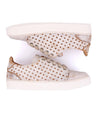 A pair of white Lyne sneakers with polka dots on them from the Bed Stu brand.