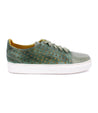 A green leather Lyne sneaker with holes and white soles by Bed Stu.