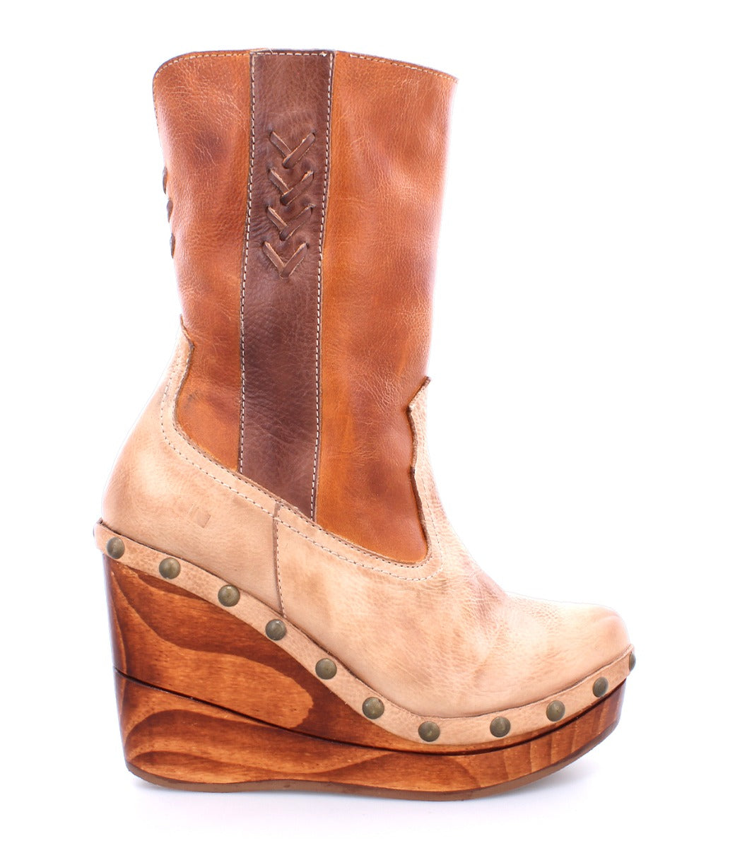 Bed|Stü Macarena two-tone color block leather mid-calf boot on a wooden wedge platform with metal stud detailing and a cushioned insole.