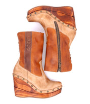 Bed|Stü Macarena two-tone color block leather mid-calf boots with side zippers, decorative stitching, and wood-toned wedge soles with metal studs.