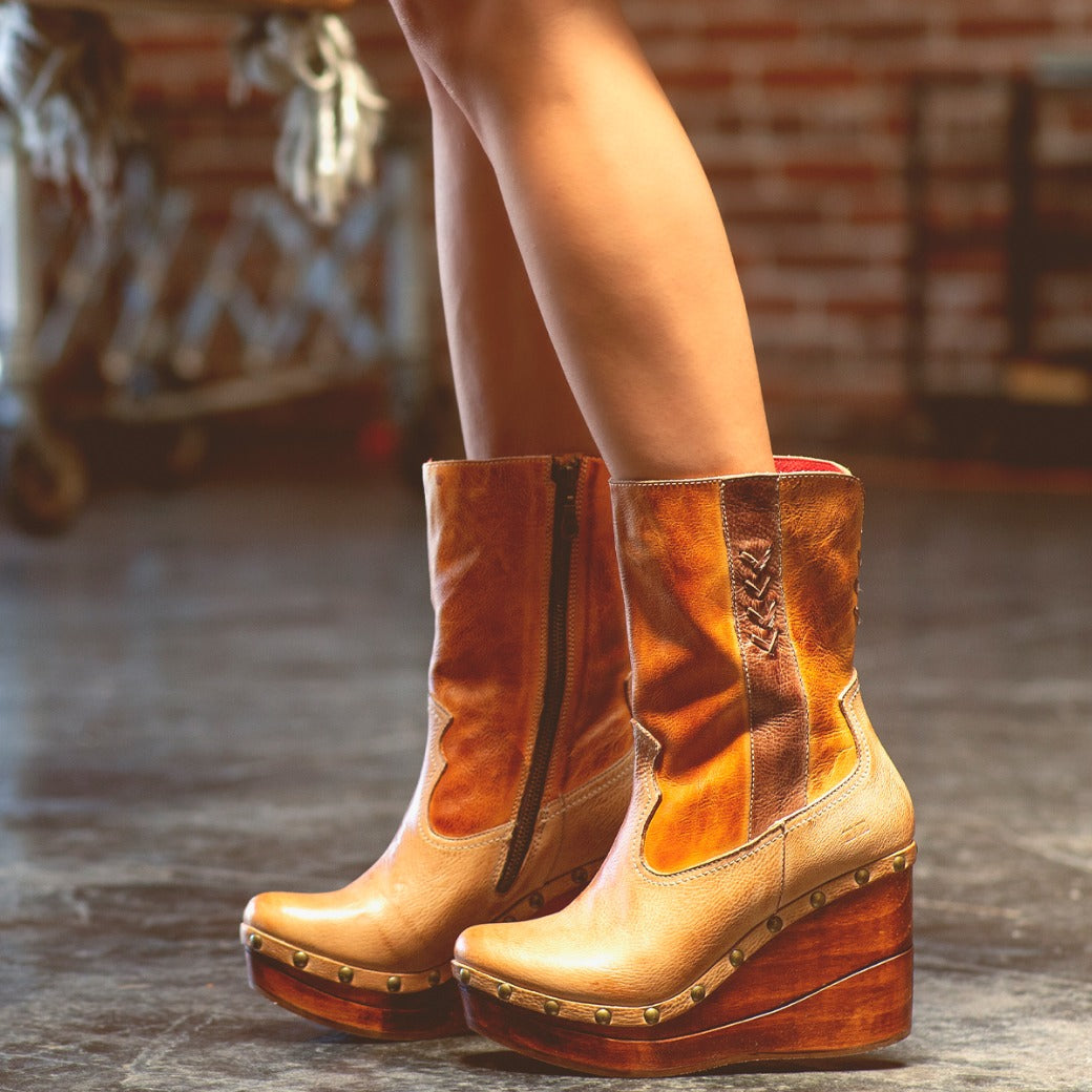 Bed|Stü Macarena two-tone color block leather mid-calf boots with studded wooden wedge heels and a cushioned insole.