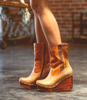 Bed|Stü Macarena two-tone color block leather mid-calf boots with studded wooden wedge heels and a cushioned insole.