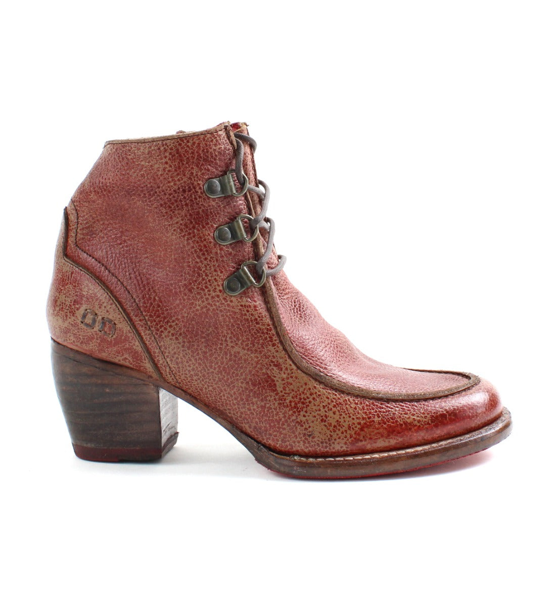 A women's distressed red ankle boot with a wooden heel called the Mage by Bed Stu.