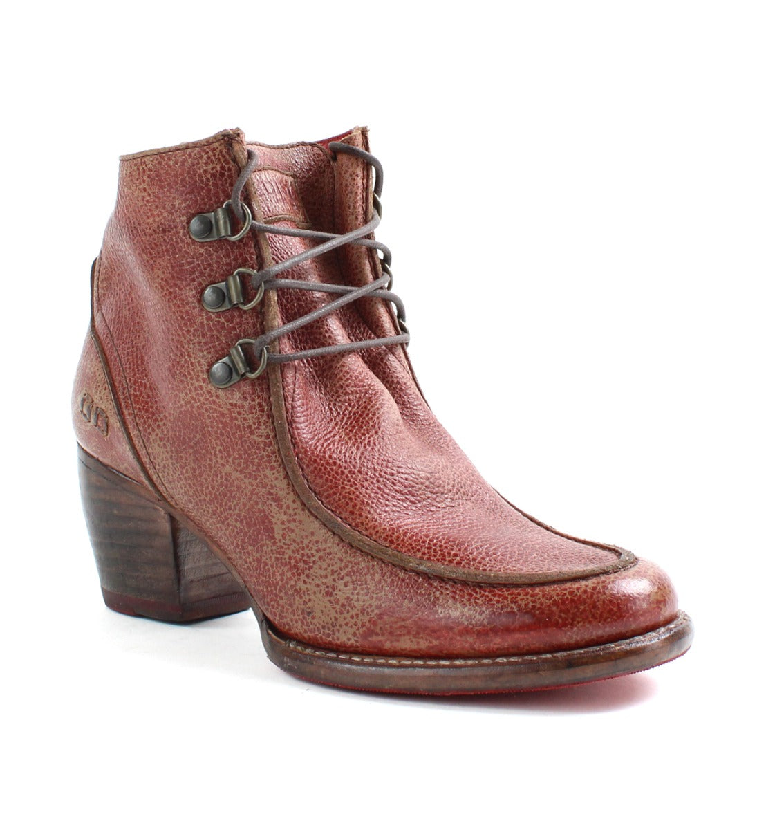 A women's distressed red ankle boot with a wooden heel called the Mage by Bed Stu.