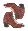 A pair of Bed Stu women's distressed red leather ankle boots.