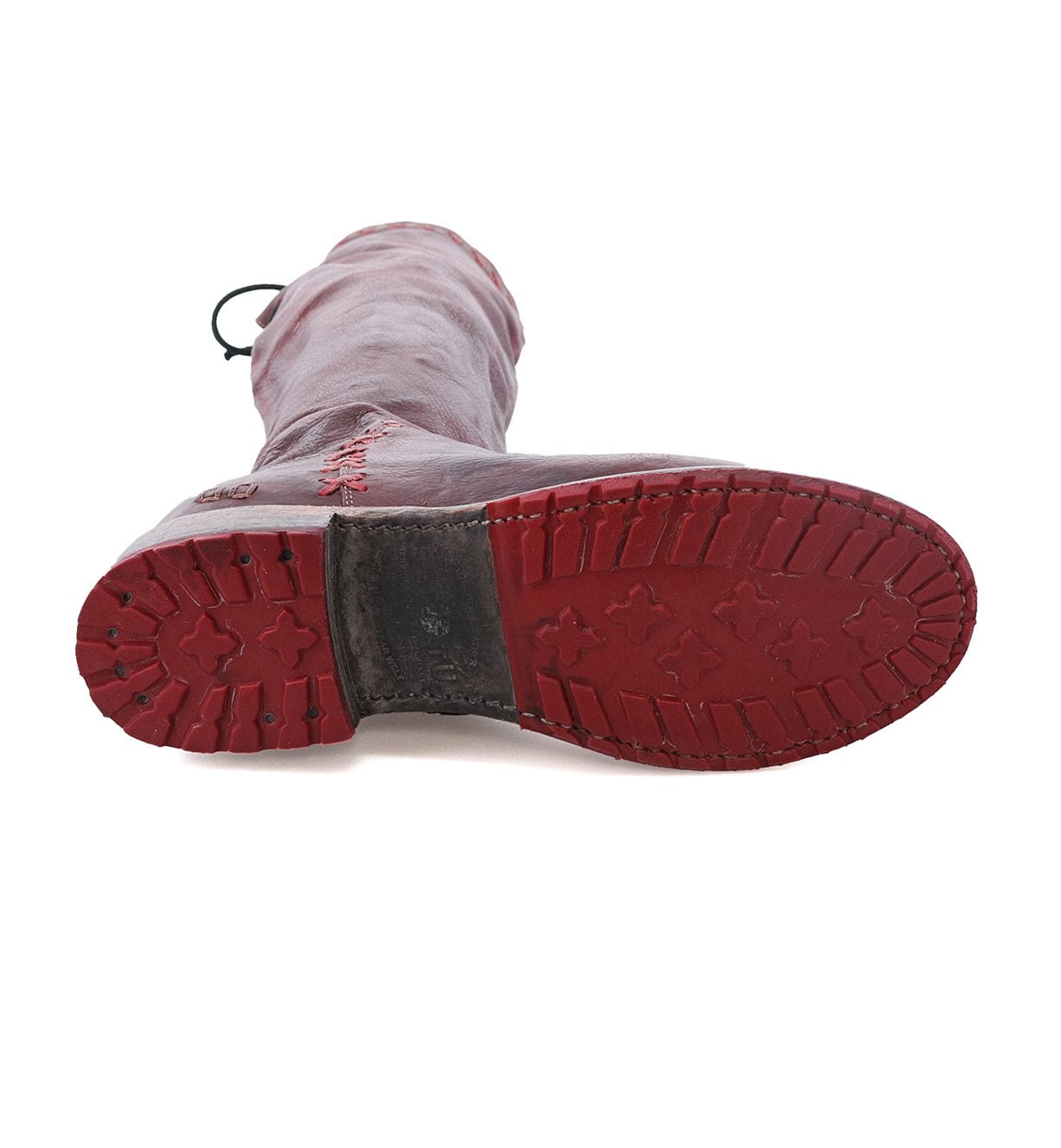 A pair of Manchester III red rubber boots on a white background by Bed Stu.