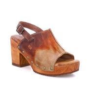 A women's brown leather clog with wooden heel, called Marie by Bed Stu.