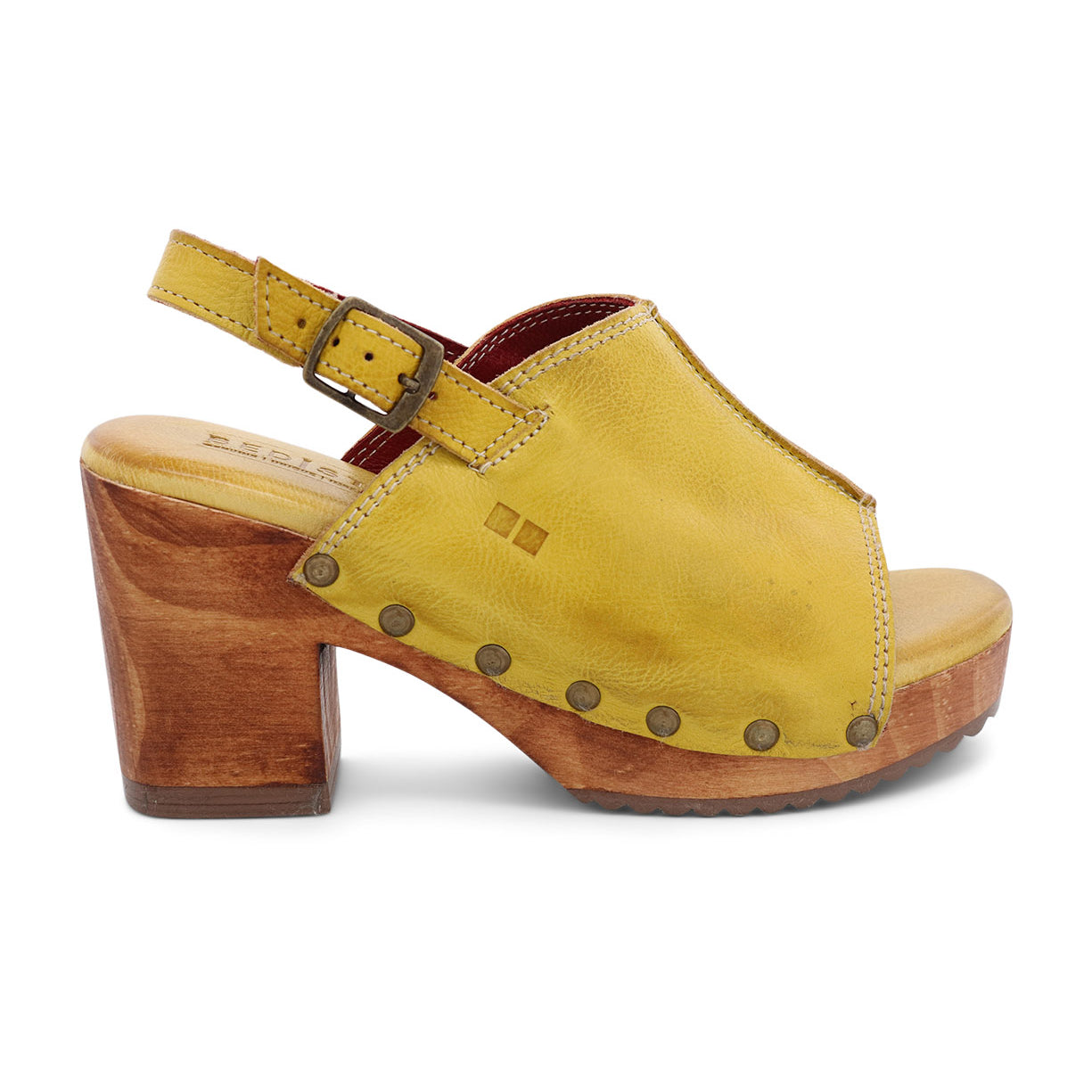 A women's yellow sandal with wooden heel.
