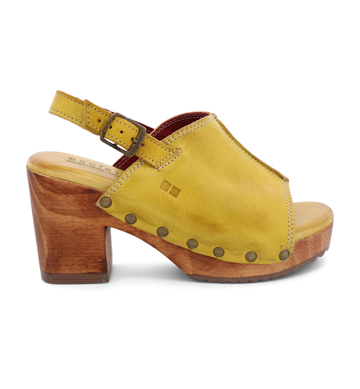 A women's yellow sandal with wooden heel.