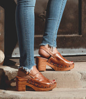 A woman wearing a pair of Marie sandals from Bed Stu.
