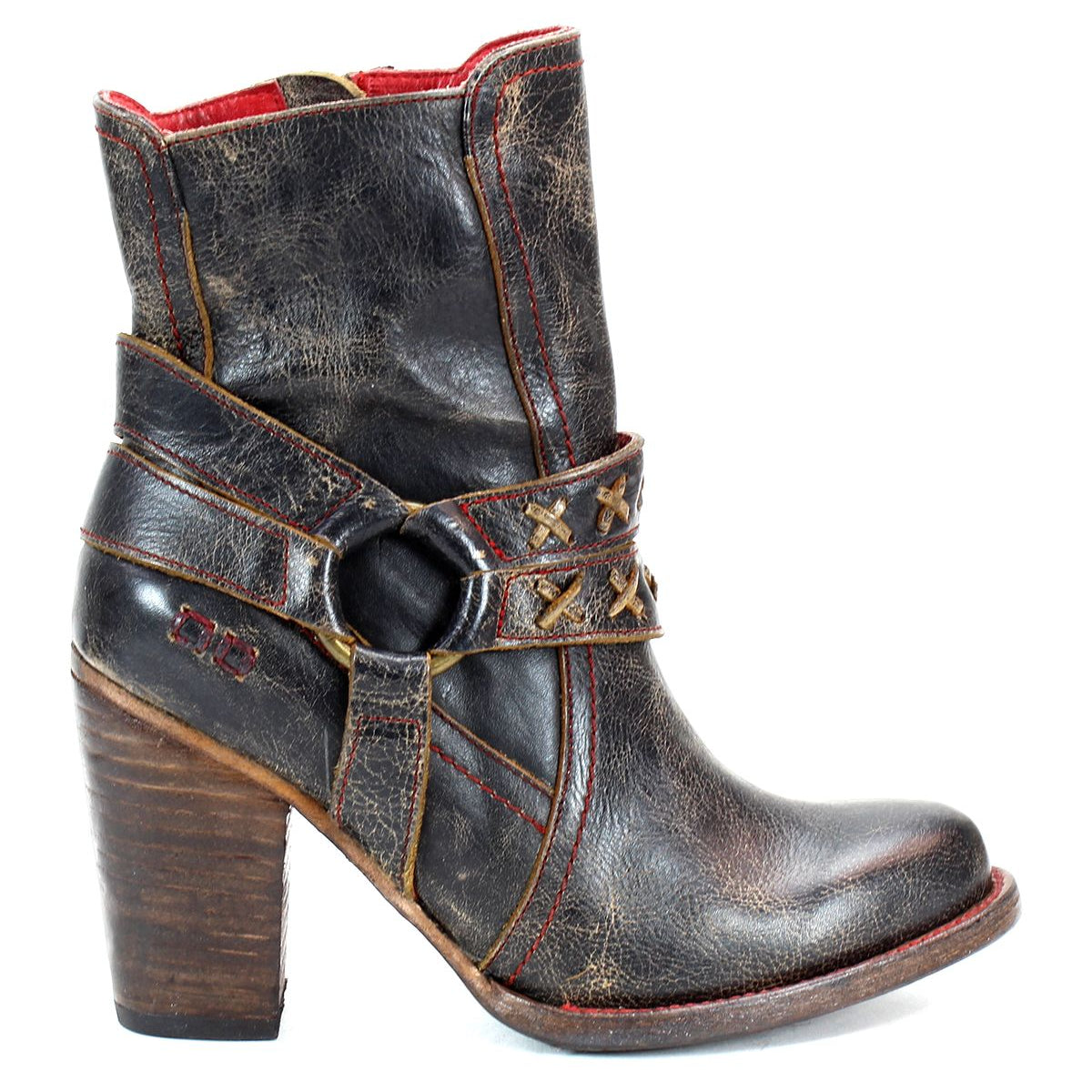 A black distressed leather boot with a high heel, red stitching and o-ring harness. on the profile view. 