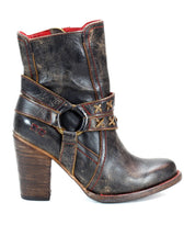 A black distressed leather boot with a high heel, red stitching and o-ring harness. on the profile view. 