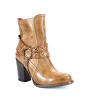 A brown leather heeled boot with o-ring harness, red stitching accents on the45 degree angle view. 