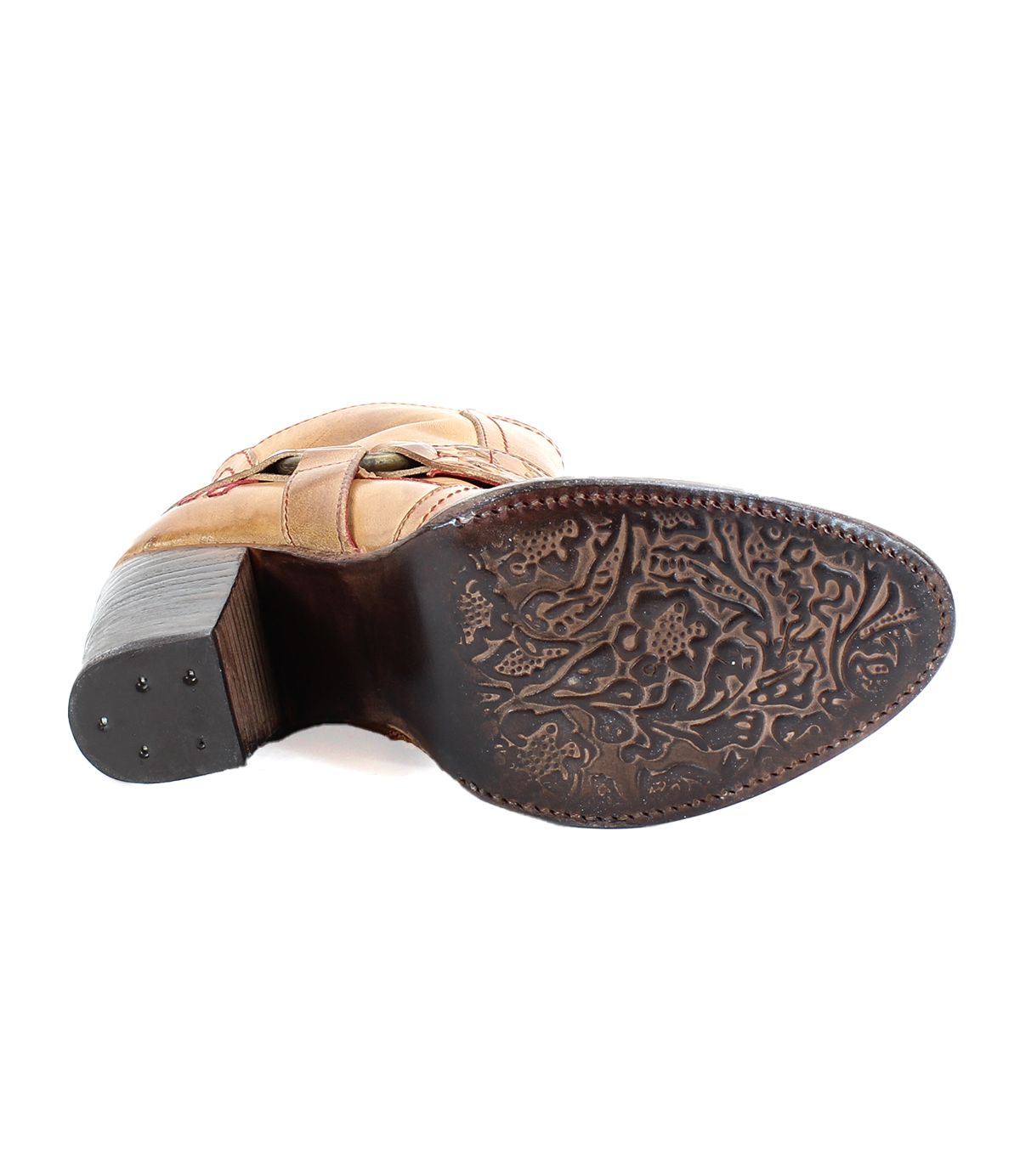 A brown leather heeled boot with o-ring harness, red stitching accents on the outsole view. 