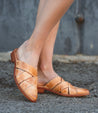 A woman wearing a Mayra mule from Bed Stu.