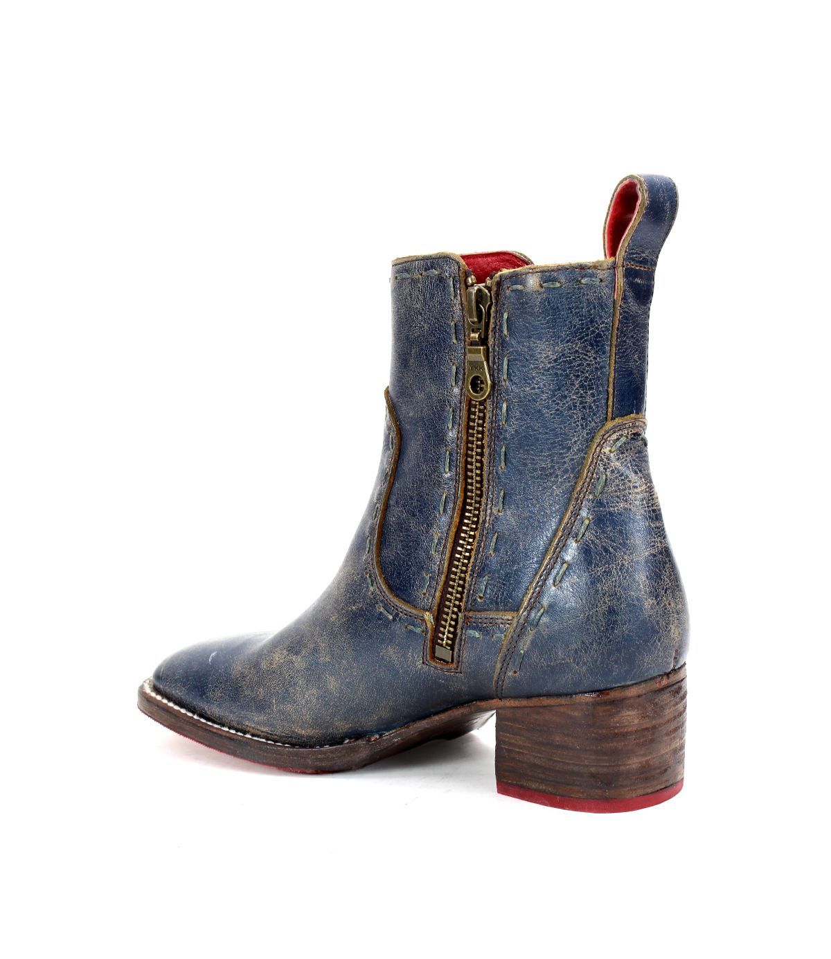 The Bed Stu Merryli ankle boot, shown in a side view, features distressed blue leather with a low wooden heel, side zipper, and pull tab. It also incorporates an eco-friendly cushioned insole for ultimate comfort.