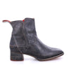A black leather Merryli ankle boot with a red sole by Bed Stu.