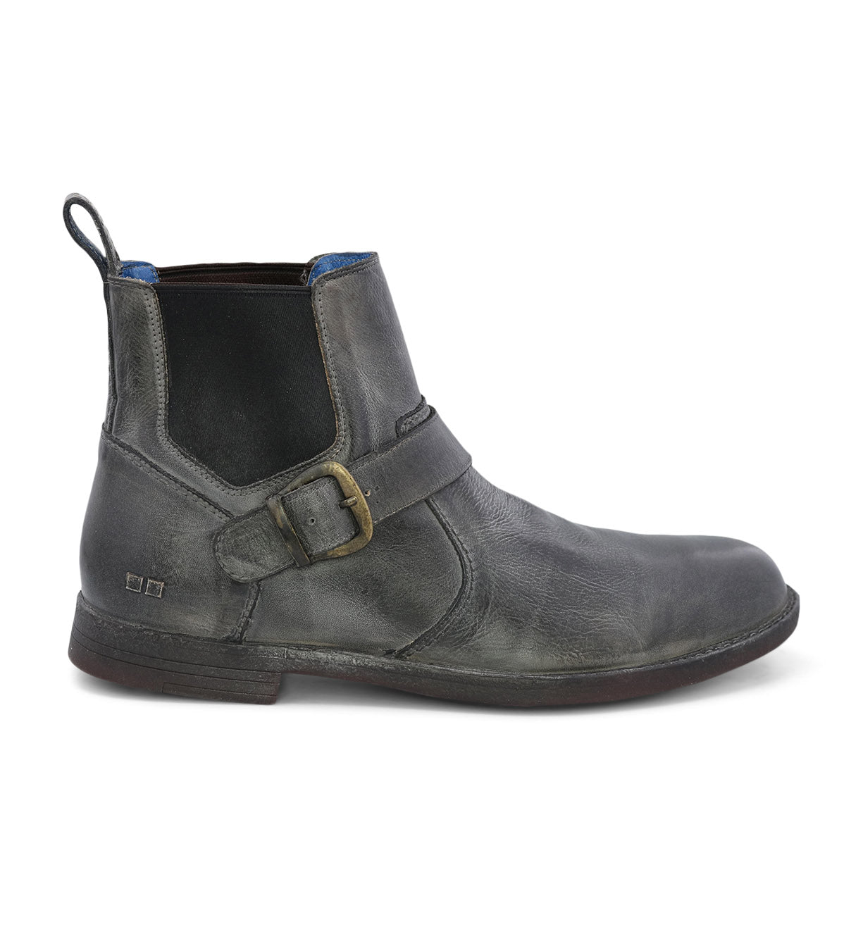 The Bed|Stü Michelangelo is a single black leather Chelsea boot featuring a buckle accent and elastic side panel, with a low heel, pull tab, and durable rubber outsole, displayed on a white background.