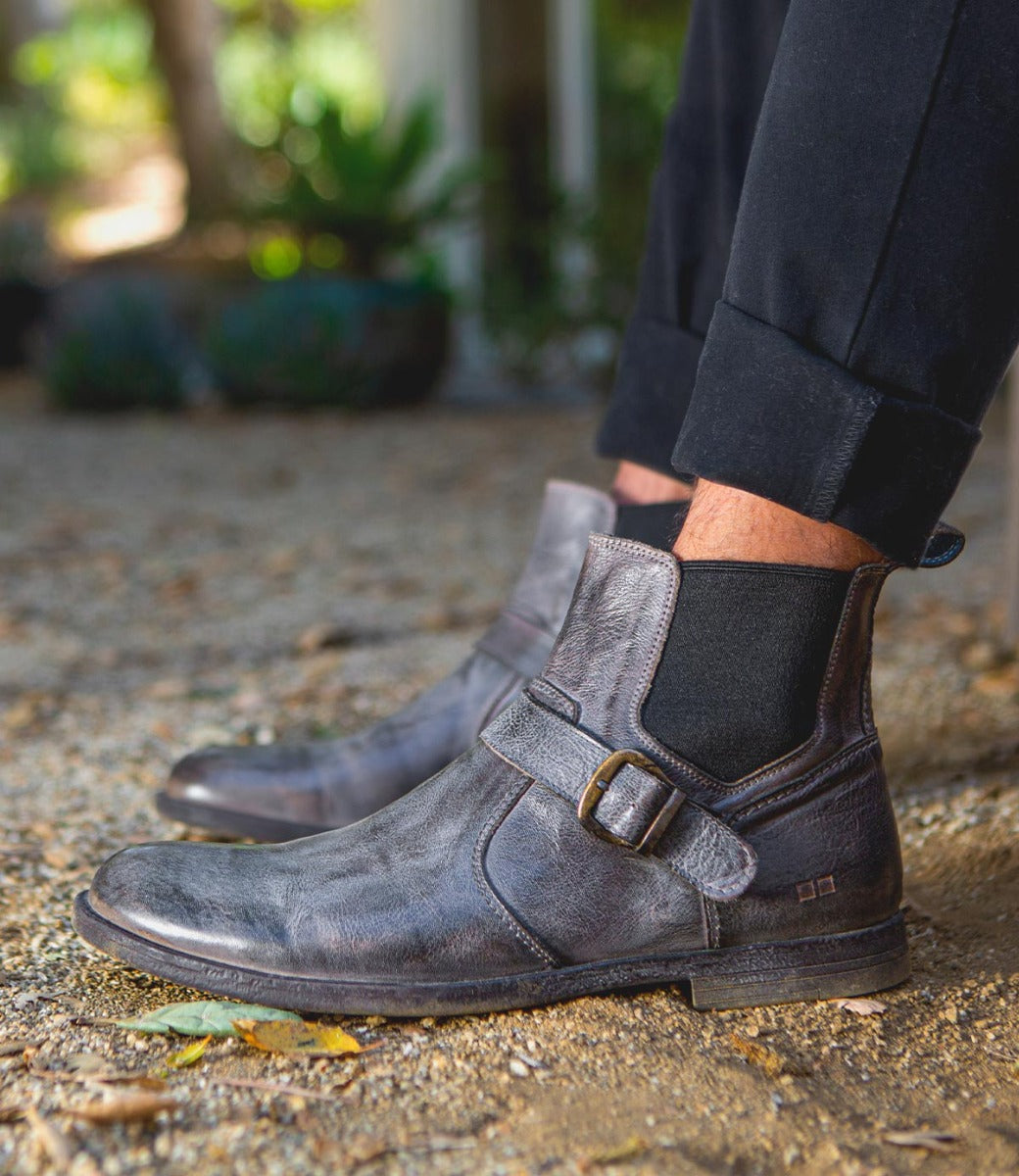 A man wearing a pair of Bed Stu Michelangelo grey leather chelsea boots.