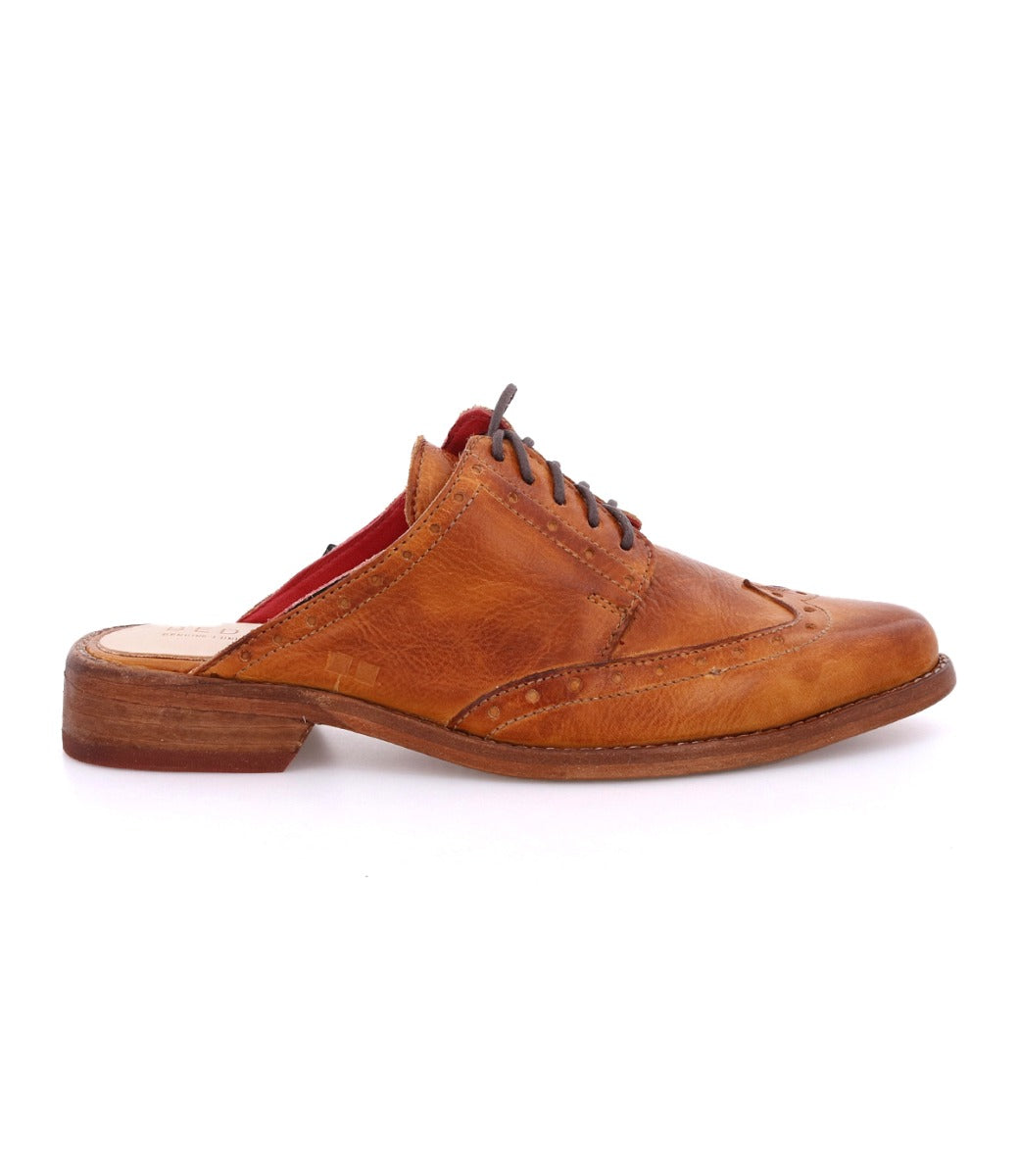 A Mickie by Bed Stu tan leather lace up shoe with a red sole.