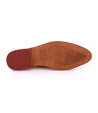 A pair of Bed Stu Mickie shoes with red soles on a white background.