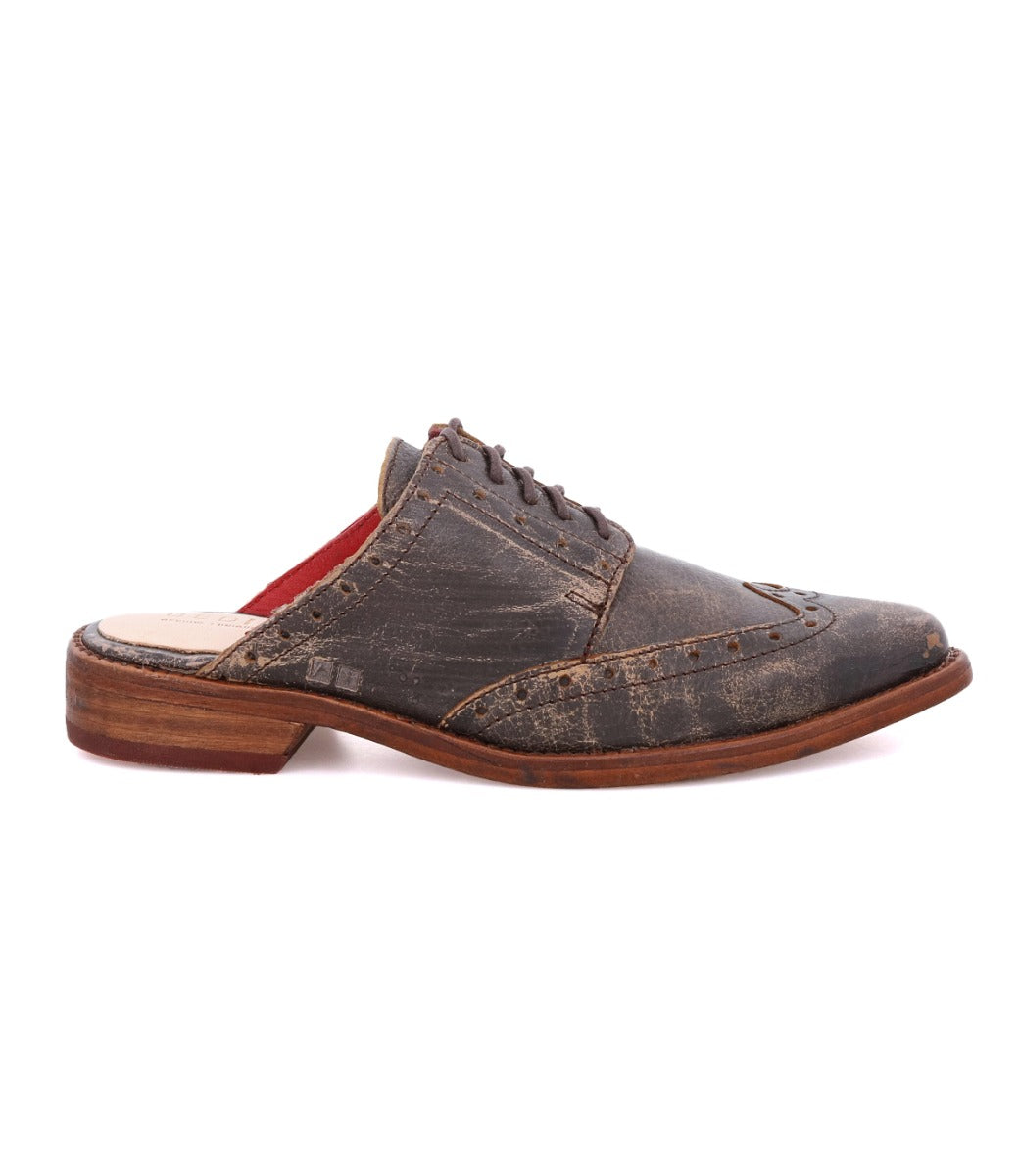 A pair of Mickie men's brown oxford shoes with a red sole by Bed Stu.