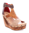 A Millennial sandal with a wooden platform and straps by Bed Stu.
