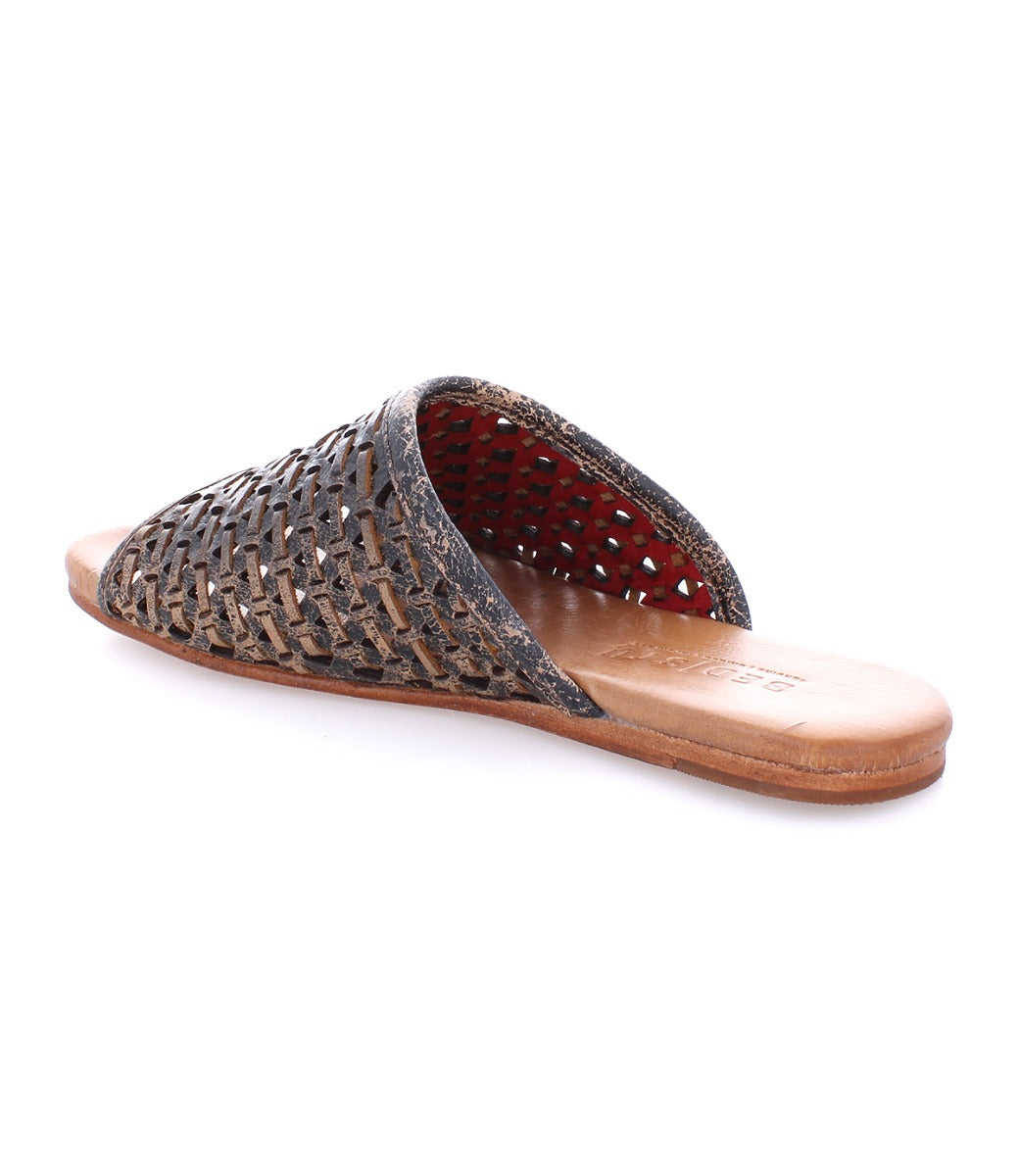A women's woven slipper with a brown leather sole, the Minerva slipper by Bed Stu.