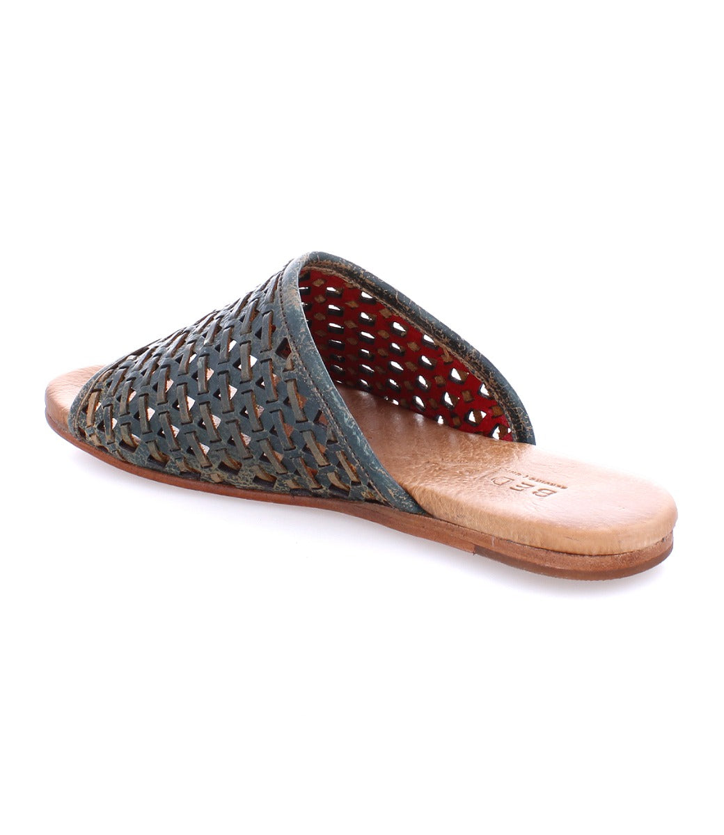 A women's woven slipper with a leather sole, the Minerva slipper by Bed Stu.
