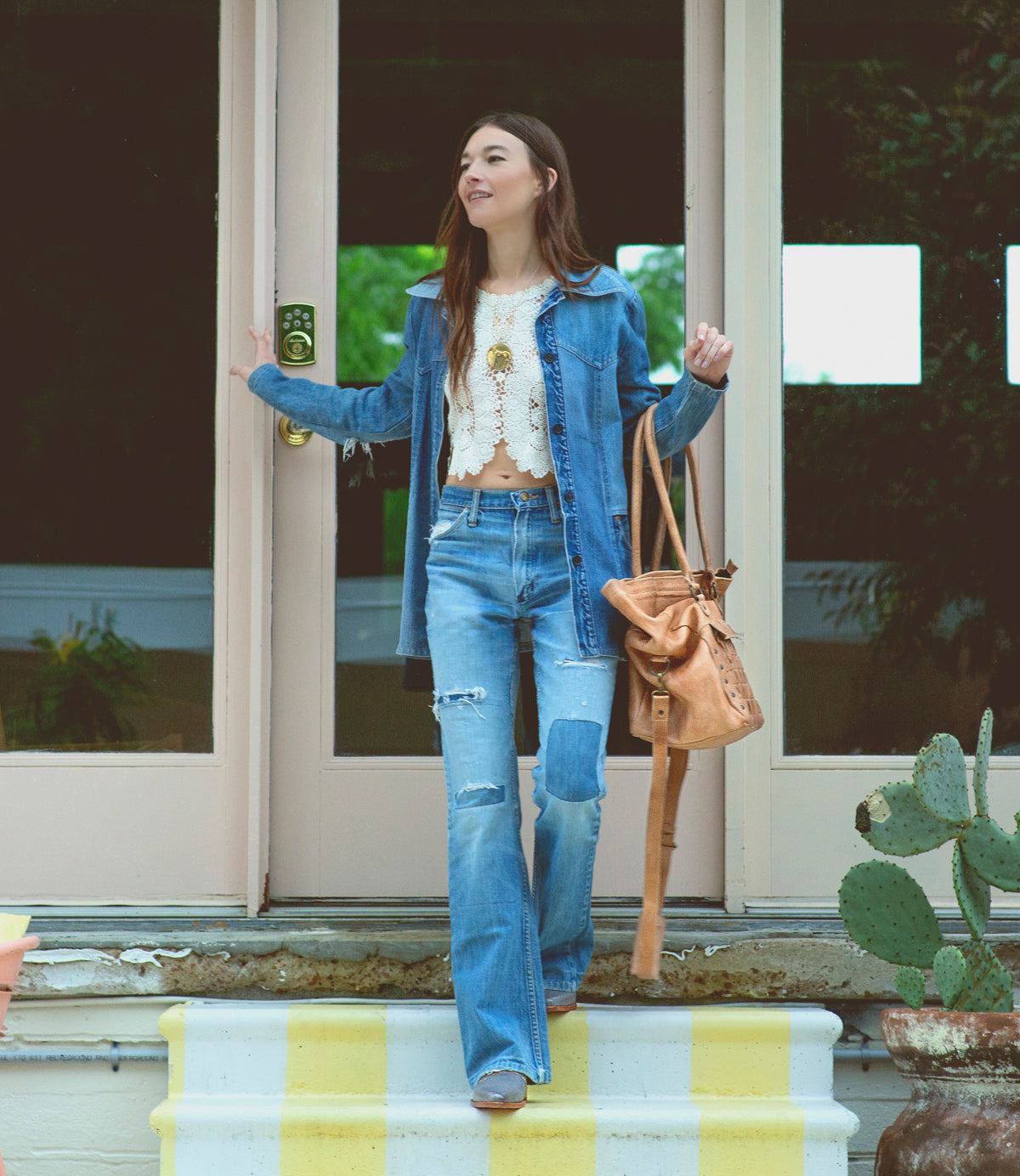 A woman wearing a Miriam handbag by Bed Stu.