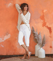 A woman wearing Bed Stu Miya tan pure leather sandals.