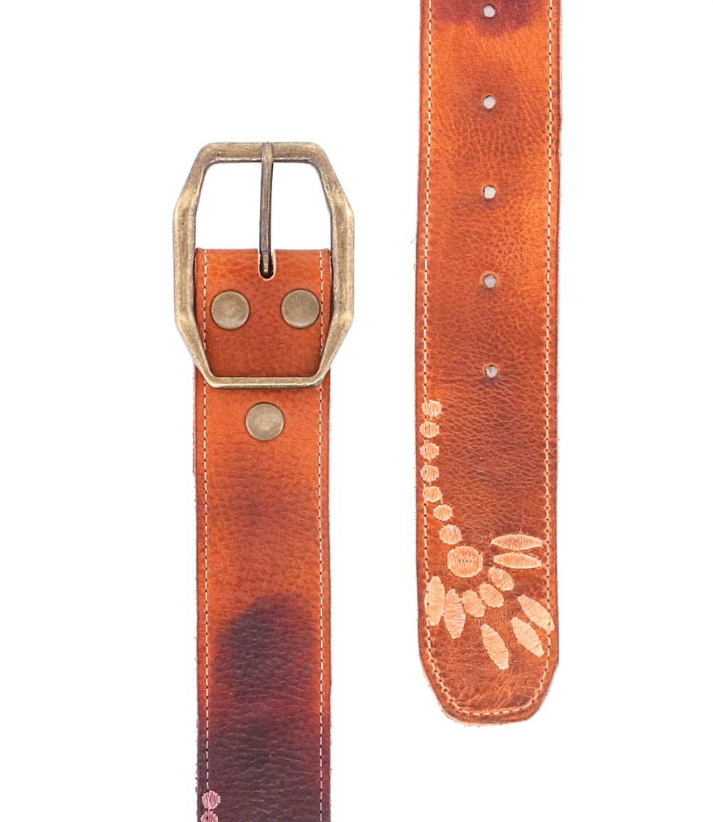 A brown leather Mohawk belt with a flower on it. (Brand: Bed Stu)