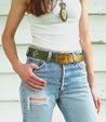 A woman wearing jeans and a Mohawk Bed Stu belt.