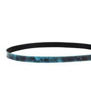 An image of a black and blue Bed Stu Monae belt coiled in a loop with a smooth texture and a shimmering pattern on the outer surface.