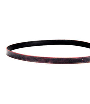 A Bed Stu Monae belt in black leather with red edging, displayed in a circular shape, isolated on a plain white background.