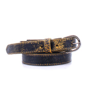 A worn black leather Bed Stu Monae belt with a tarnished metal buckle, coiled neatly.