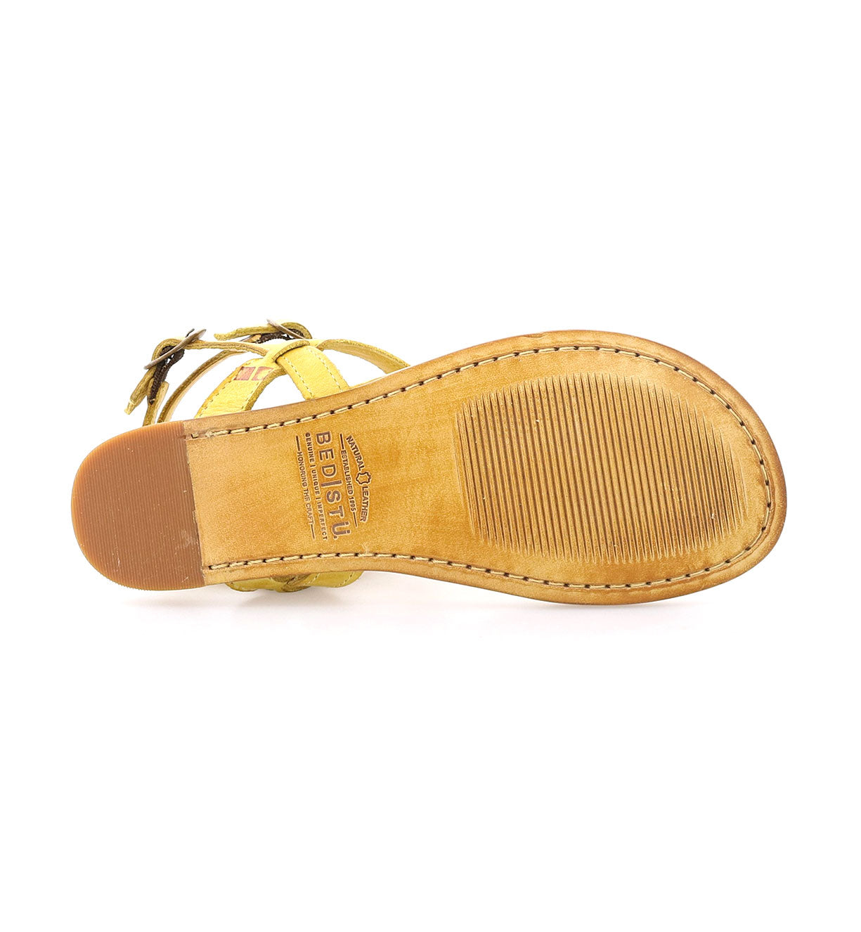 A pair of Moon yellow sandals on a white background by Bed Stu.