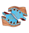 A pair of Naiya wedge sandals with wooden soles by Bed Stu.