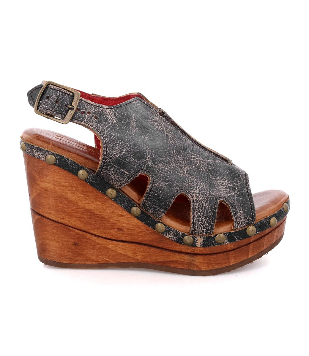 A women's wedge sandal with a wooden platform and straps called Naiya by Bed Stu.