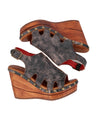 A women's black wedge sandal with a wooden platform by Bed Stu.