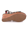 A pair of Bed Stu Naiya women's sandals with a wooden sole.