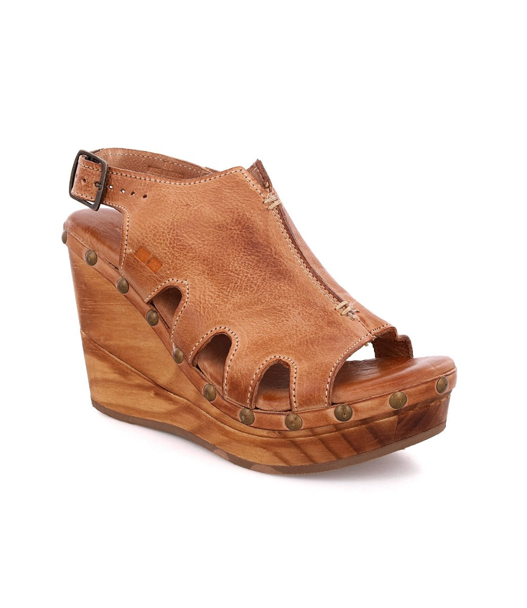 A women's tan wedge sandal with wooden wedges, Naiya by Bed Stu.