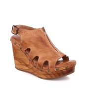 A women's tan wedge sandal with wooden wedges, Naiya by Bed Stu.