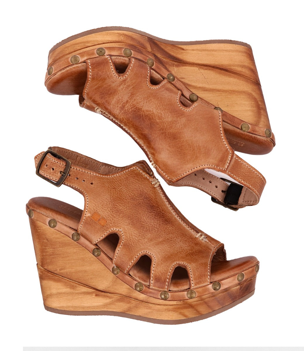 A pair of Naiya wedge sandals in tan by Bed Stu.
