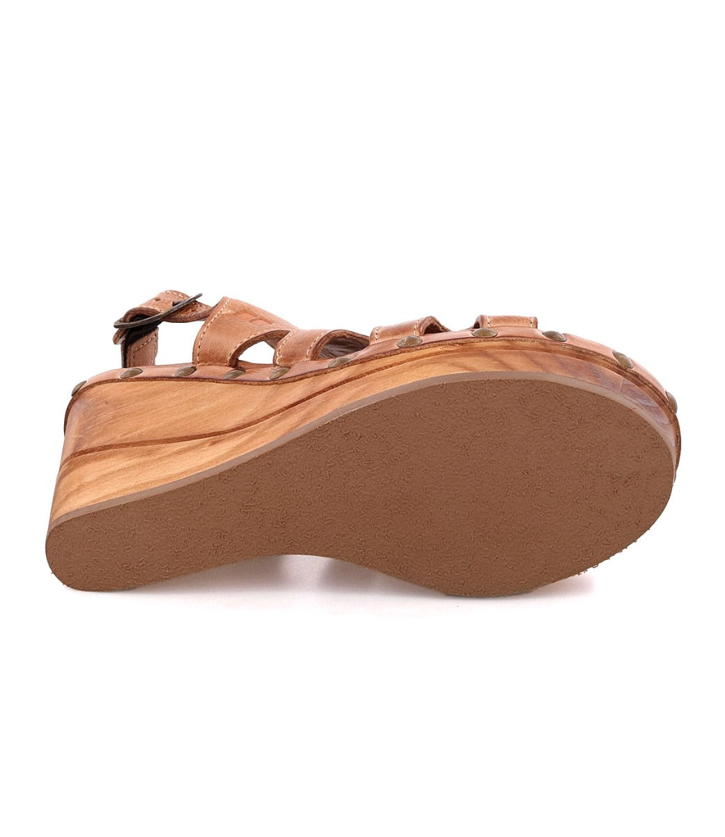 A woman's Naiya sandal with straps and a wooden sole from Bed Stu.