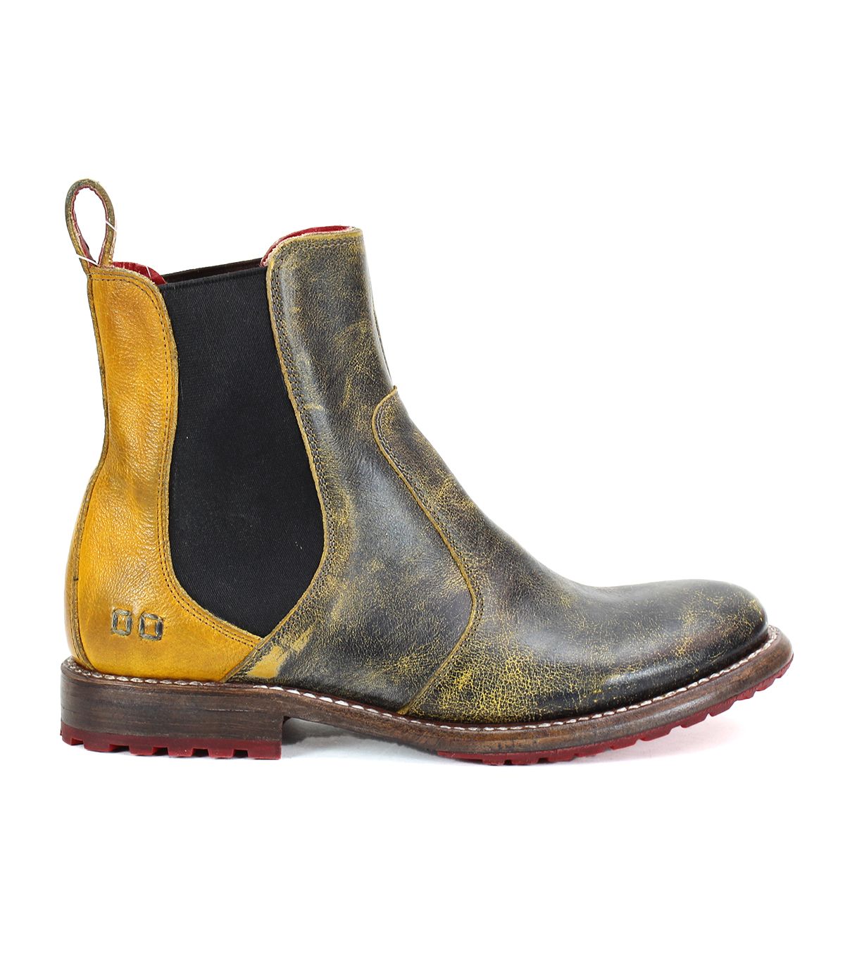 The Nandi by Bed Stu is a single leather Chelsea boot with a worn, vintage appearance, featuring elastic side panels and a pull tab at the back. This stylish piece of women's footwear showcases a brown and yellow color scheme with a striking red sole. Perfect for any woman looking to add fashionable boots to her collection.