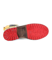 The image features the bottom view of the "Nandi" Chelsea boot with a distinctive red rubber sole and a visible "Bed Stu" brand name, exemplifying stylish women's fashion footwear.